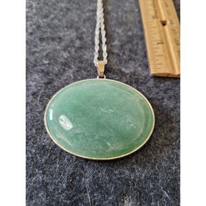 Beautiful Oval Aventurine pendant in silver tone accent metal.  On silver chain